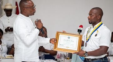Handing over the Charter Certificate as symbol of handover to new leadership